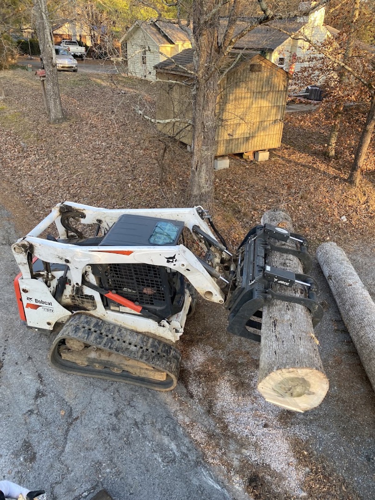 A tree stump being ground out on a Knoxville property